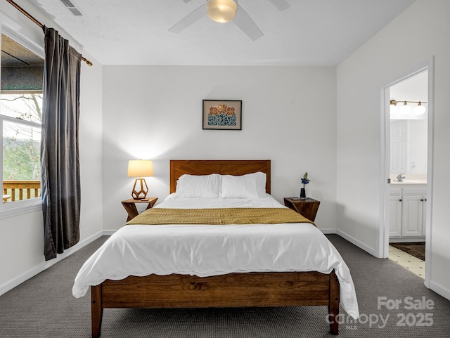 carpeted bedroom featuring ensuite bathroom and ceiling fan