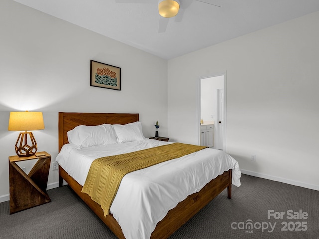 bedroom featuring ensuite bath, ceiling fan, and dark colored carpet