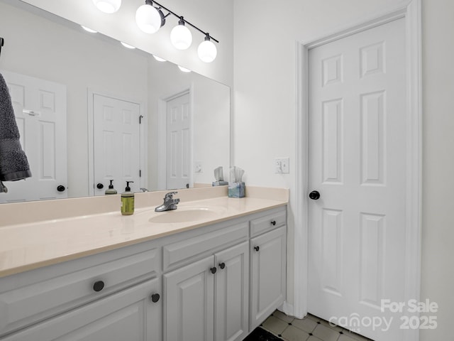 bathroom with vanity and tile patterned floors