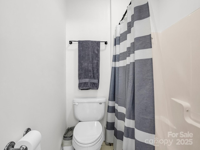 bathroom with walk in shower and toilet