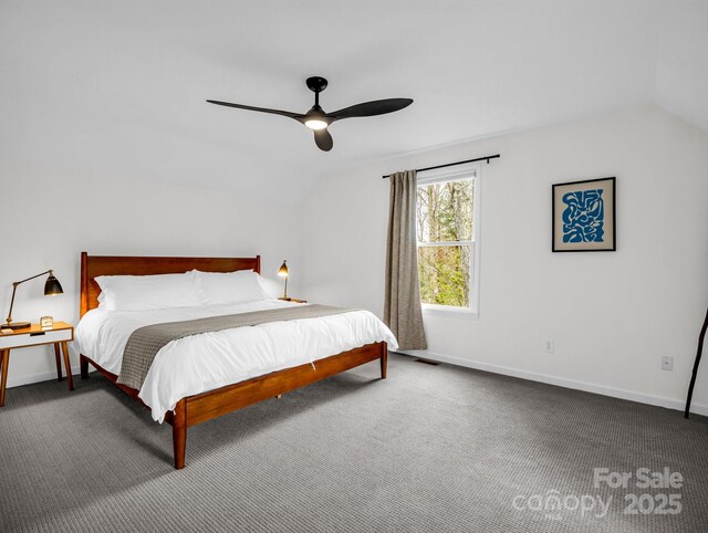 bedroom featuring ceiling fan, carpet floors, and vaulted ceiling