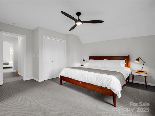 bedroom featuring ceiling fan, carpet flooring, vaulted ceiling, and a closet