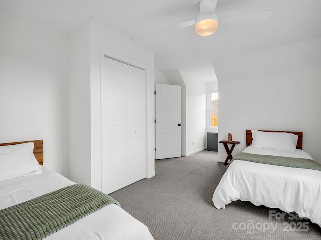 bedroom featuring ceiling fan, a closet, and carpet