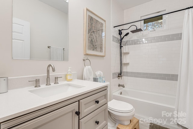 full bathroom featuring vanity, shower / tub combo, and toilet