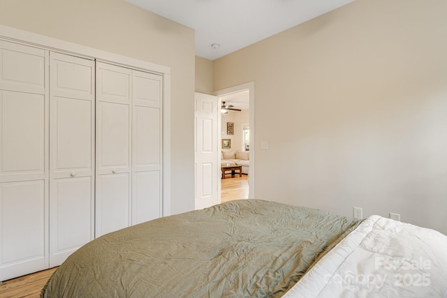 bedroom with a closet and light hardwood / wood-style flooring