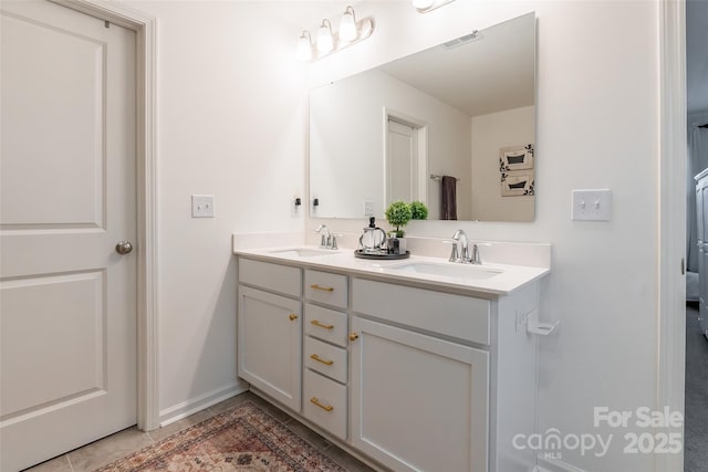 bathroom with tile patterned flooring, visible vents, a sink, and double vanity