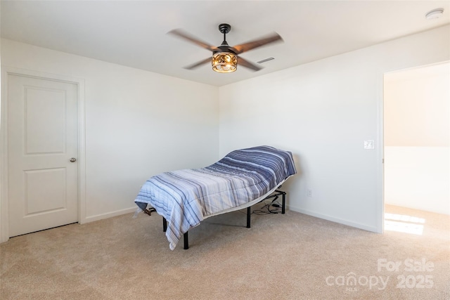 bedroom featuring light carpet, baseboards, visible vents, and ceiling fan