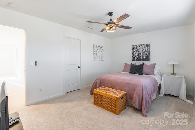 bedroom with baseboards, visible vents, ceiling fan, and light colored carpet