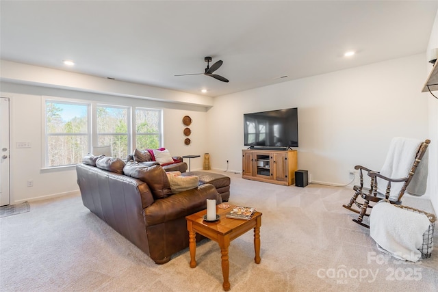 living area with light carpet, baseboards, and recessed lighting