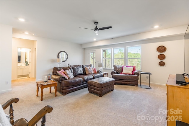 living room with recessed lighting, light colored carpet, ceiling fan, and baseboards