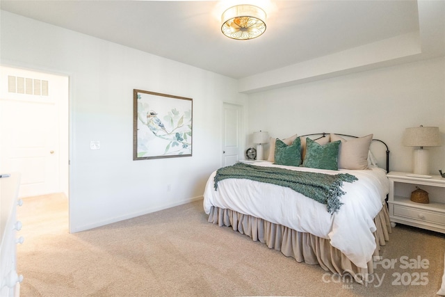 bedroom featuring carpet floors, baseboards, and visible vents