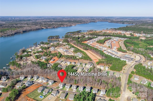 birds eye view of property featuring a water view and a residential view