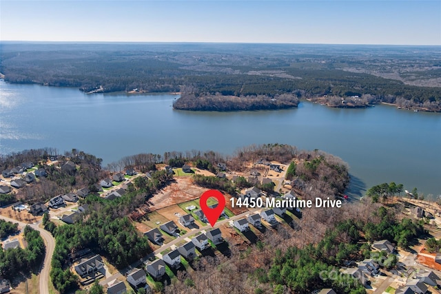 bird's eye view with a residential view and a water view