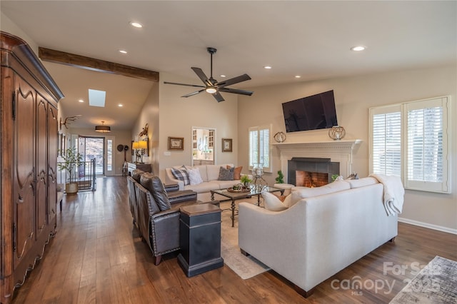 living room with ceiling fan, dark hardwood / wood-style flooring, and lofted ceiling with beams