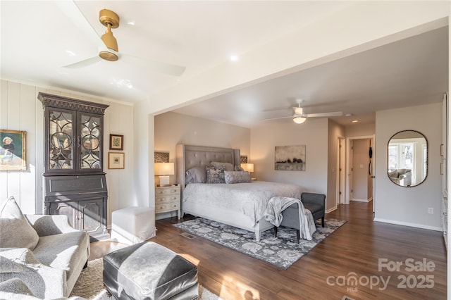 bedroom with ceiling fan and dark wood-type flooring