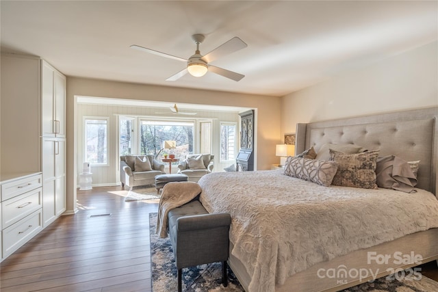 bedroom featuring ceiling fan and dark hardwood / wood-style flooring