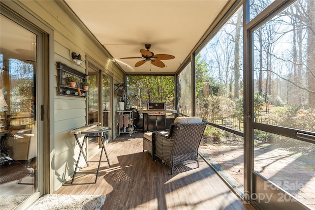 sunroom / solarium with ceiling fan