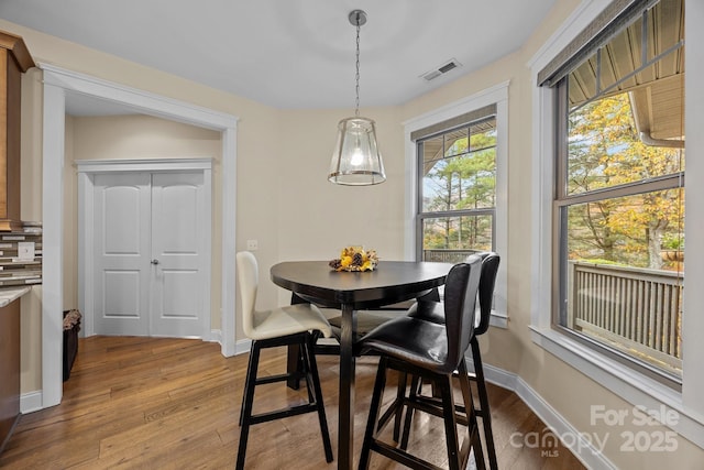 dining room featuring hardwood / wood-style flooring