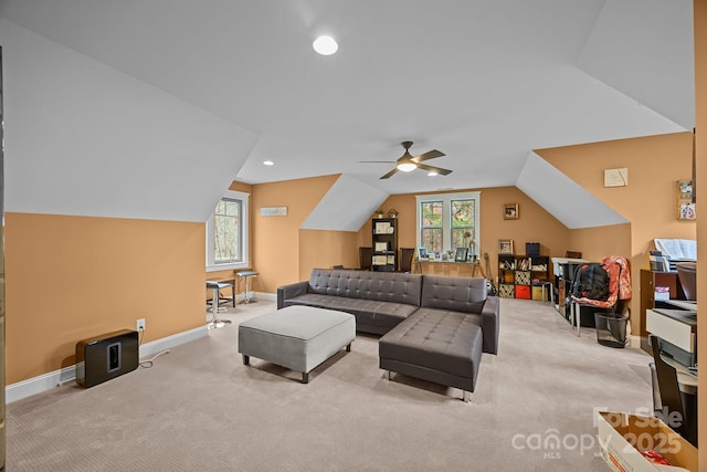 carpeted living room with ceiling fan, a healthy amount of sunlight, and lofted ceiling