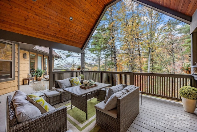 wooden terrace featuring outdoor lounge area