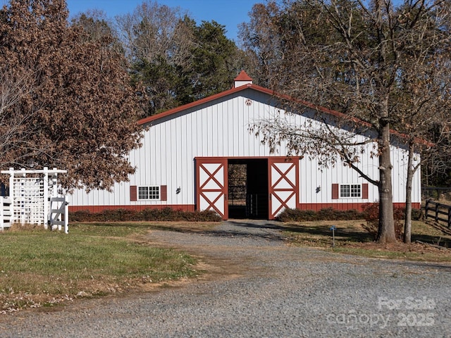 view of outbuilding featuring a yard