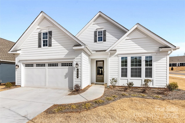 view of front of house with a garage and a front lawn