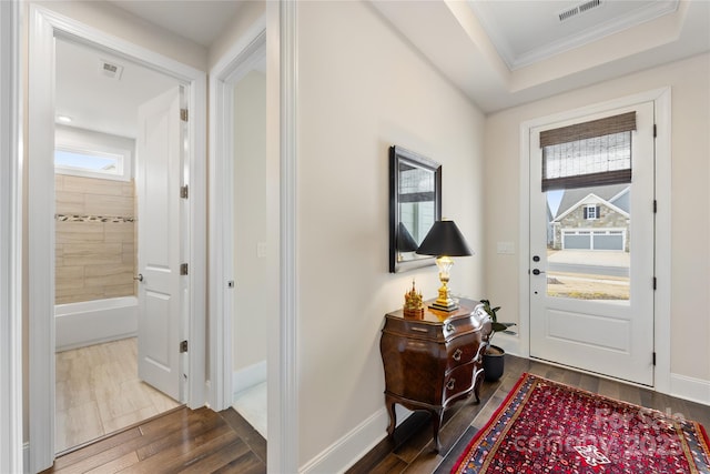 entrance foyer featuring crown molding