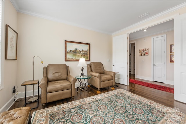 living area with ornamental molding and dark hardwood / wood-style floors