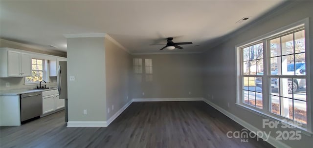 interior space featuring ceiling fan, dark hardwood / wood-style floors, sink, and crown molding