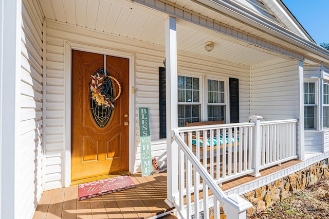 property entrance featuring covered porch