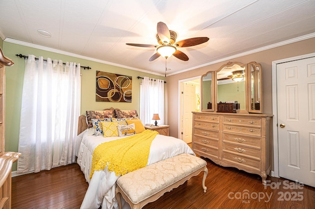 bedroom featuring dark hardwood / wood-style flooring, crown molding, and ceiling fan