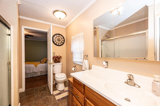 bathroom featuring ornamental molding, toilet, vanity, and a shower with shower door