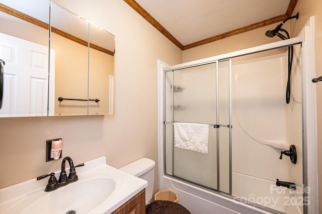 full bathroom with crown molding, vanity, shower / bath combination with glass door, and toilet