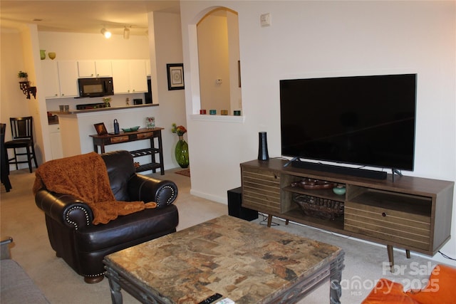 living room with light colored carpet