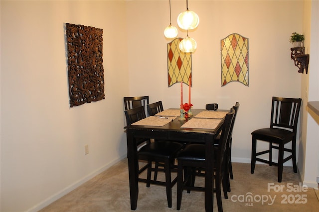 view of carpeted dining area