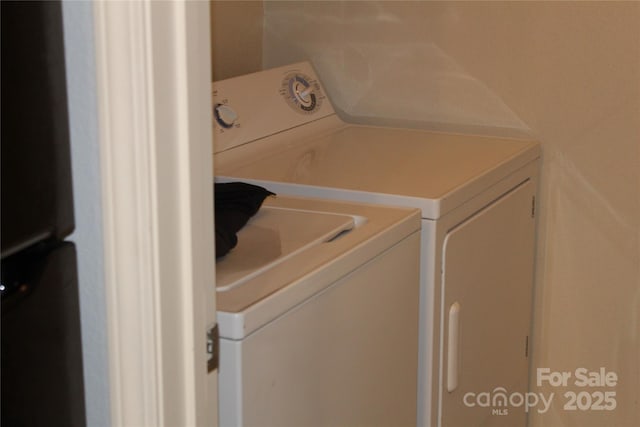 laundry area featuring washer and clothes dryer