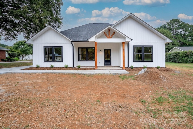 modern inspired farmhouse with a porch