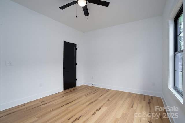 spare room with ceiling fan and light hardwood / wood-style flooring