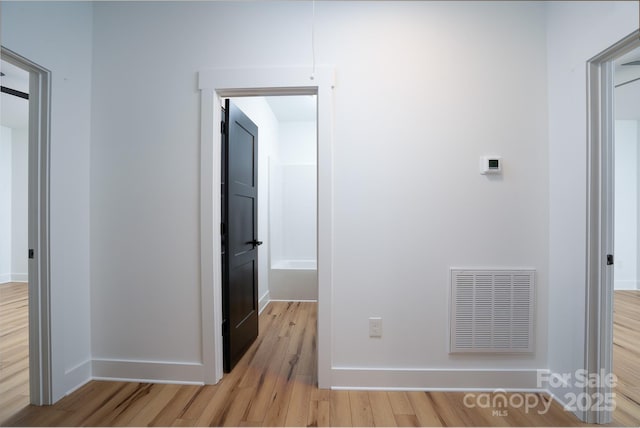 corridor featuring light wood-type flooring