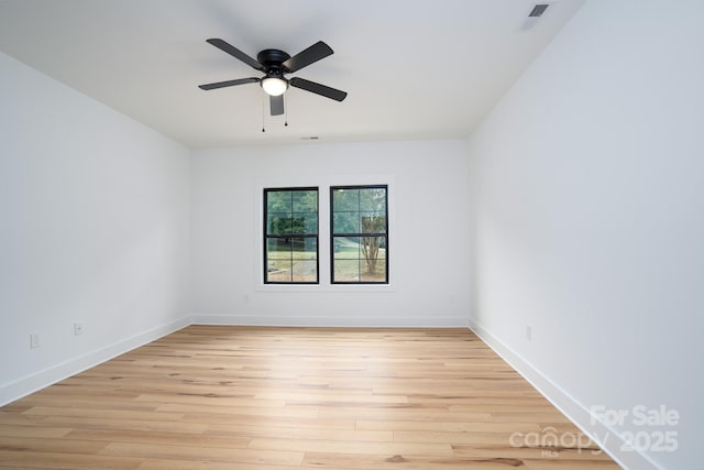 unfurnished room featuring ceiling fan and light wood-type flooring