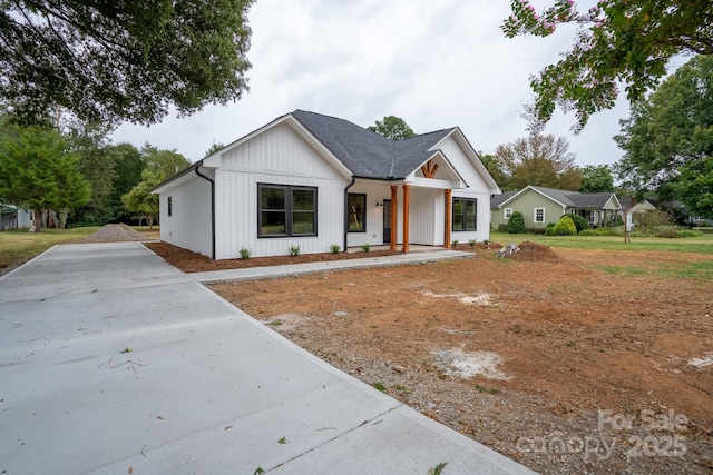 modern inspired farmhouse with covered porch