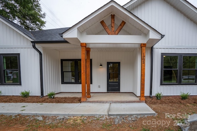 property entrance with covered porch