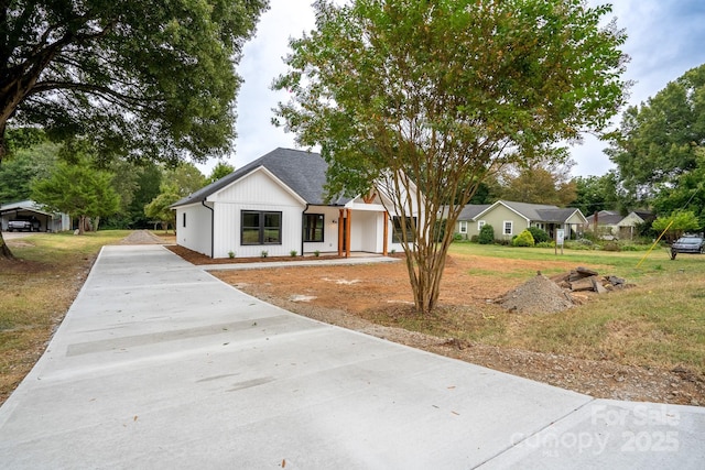 modern inspired farmhouse with a front yard