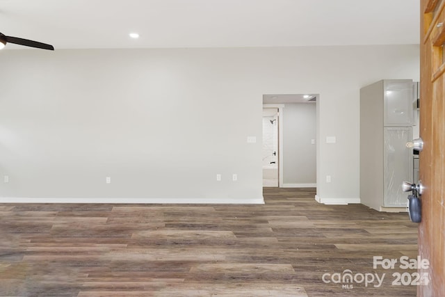 spare room with dark hardwood / wood-style floors