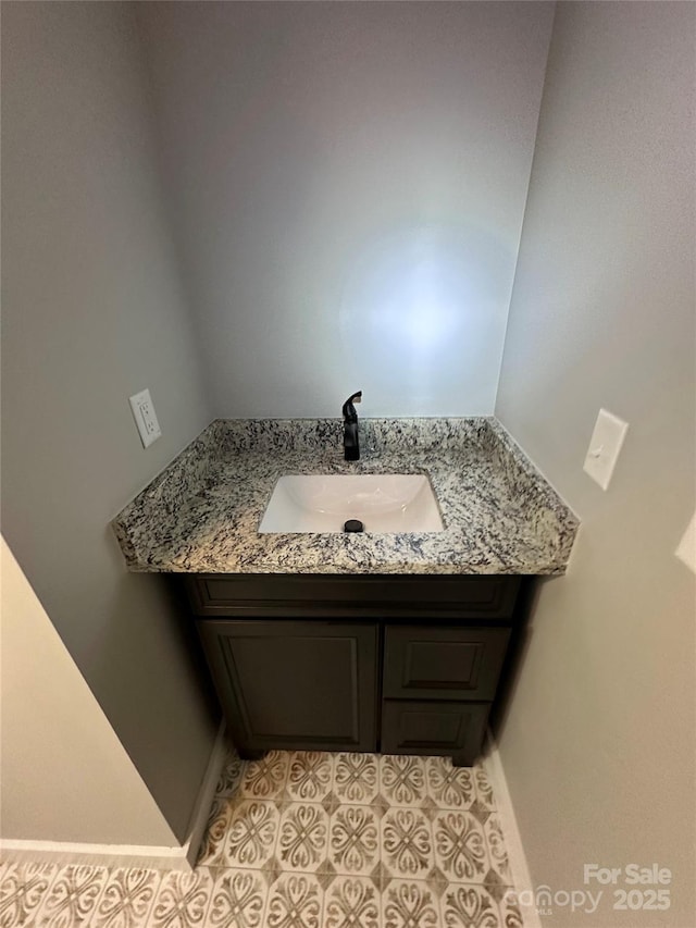 bathroom featuring vanity and tile patterned flooring