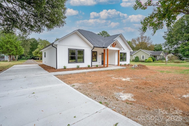 modern farmhouse style home with a porch