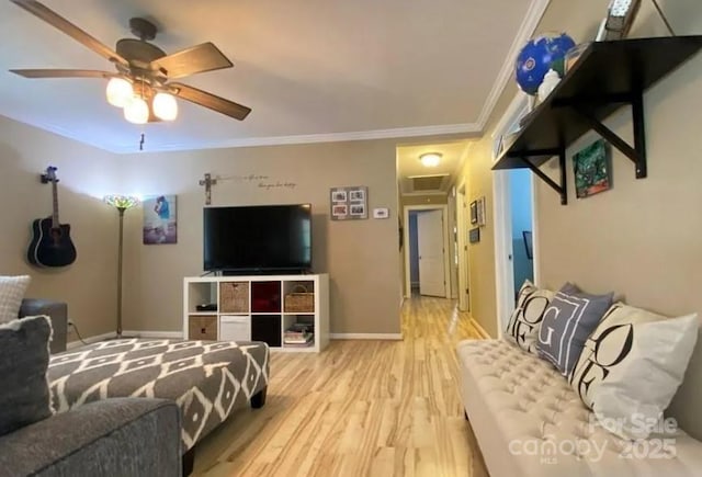 bedroom with hardwood / wood-style floors, crown molding, and ceiling fan