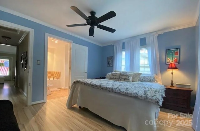 bedroom featuring connected bathroom, crown molding, light hardwood / wood-style floors, and ceiling fan