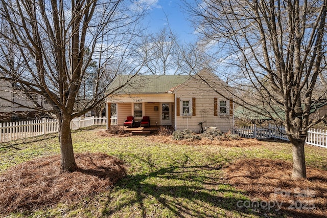 exterior space with a lawn and a fenced backyard