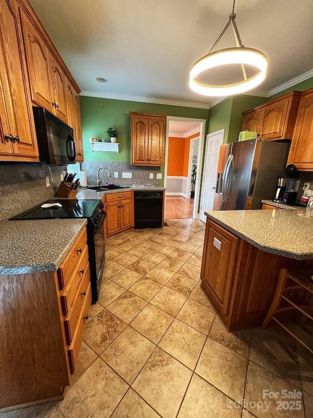 kitchen with decorative light fixtures, black appliances, decorative backsplash, sink, and ornamental molding